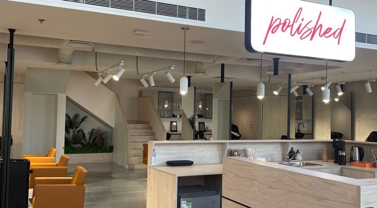 Modern salon interior at Polished, Al Khobar, Eastern Province, SA showcases stylish chairs and elegant decor.