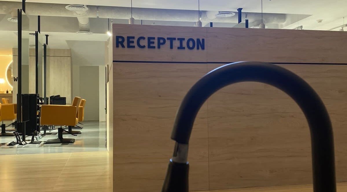 Polished salon reception with stylish yellow chairs in Al Khobar, Eastern Province, SA.