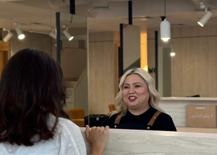 Stylist warmly greets client at Polished, Al Khobar, Eastern Province, SA.