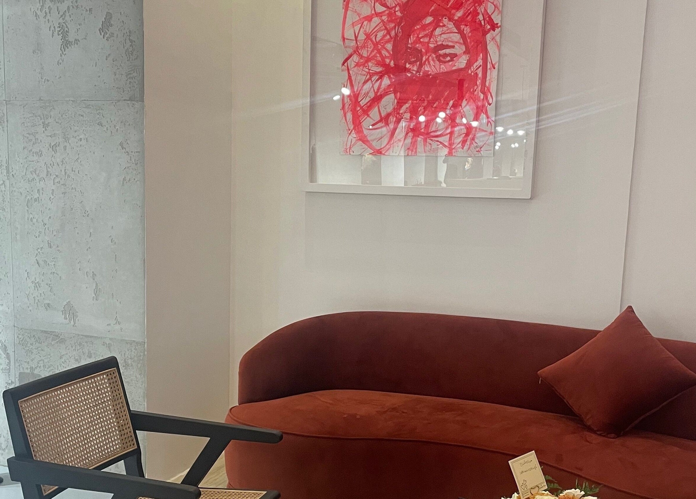 Modern lounge at Polished in Al Khobar, Eastern Province, SA with abstract art and sleek furniture.