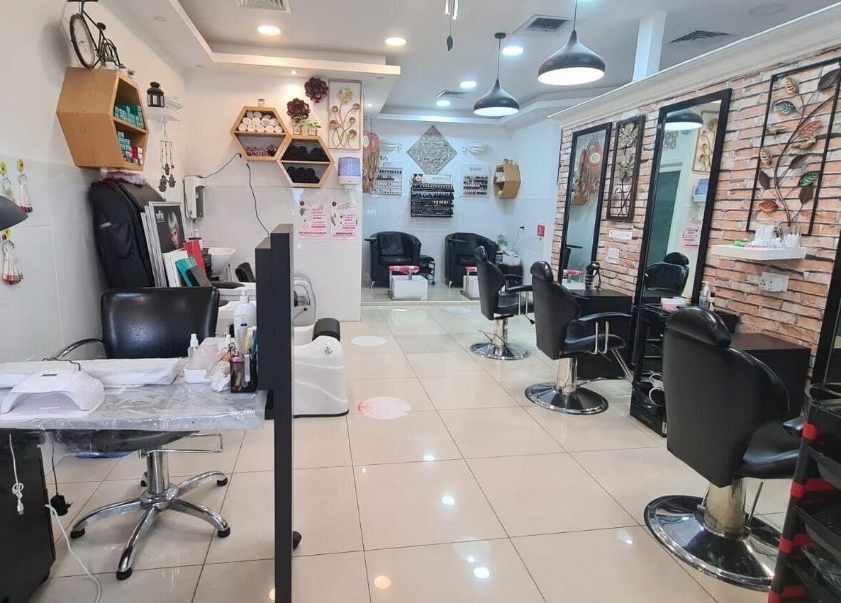 Stylish interior of Pretty Eye Ladies Saloon in Dubai, AE, featuring modern chairs and decor.