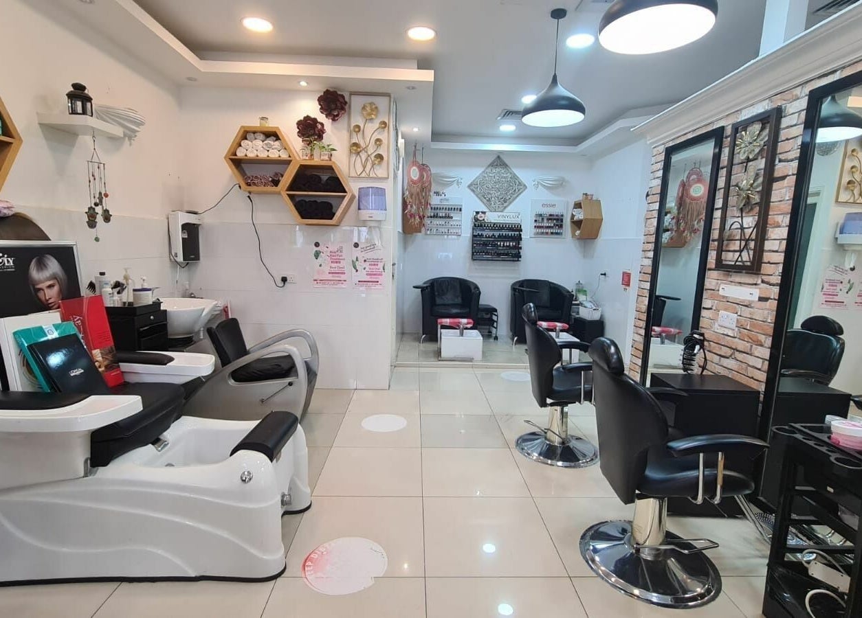 Inviting interior of Pretty Eye Ladies Saloon in Dubai, AE, featuring luxurious styling and pedicure chairs.