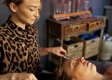Therapist provides calming face massage at The Root Wellness Center, Caro, Michigan, US.