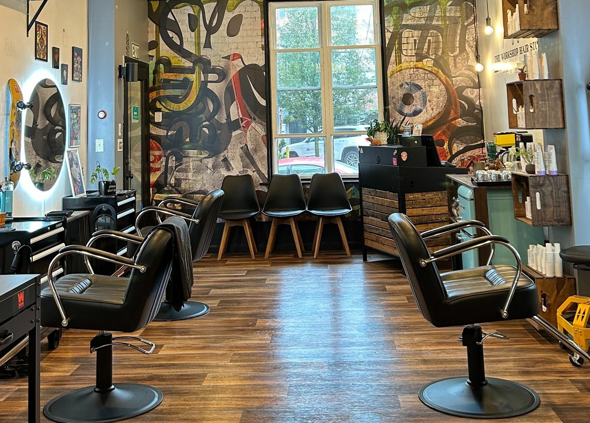 Interior of The Workshop Hair Studio in Lancaster, Pennsylvania, US, featuring chic salon chairs and vibrant decor.