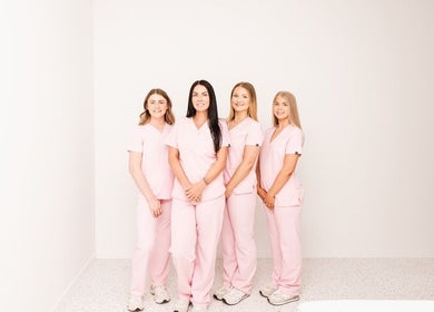 About Face team in pink uniforms at Taree, New South Wales, AU. Professional and welcoming beauty staff.