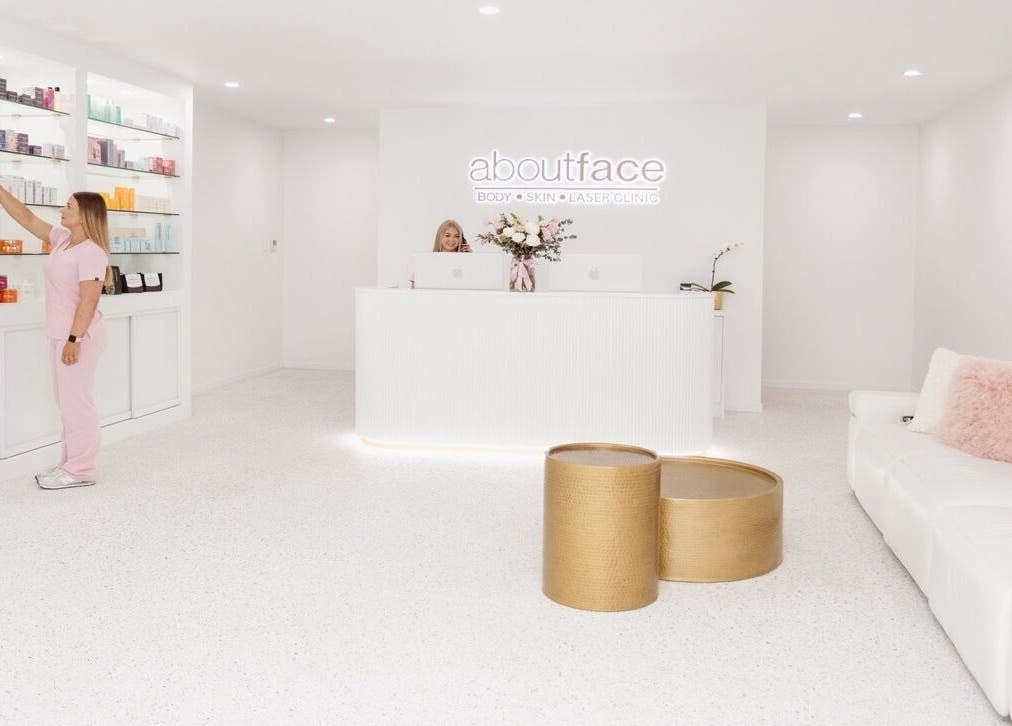 About Face reception area with staff, Taree, New South Wales, AU, showcasing modern skincare products.