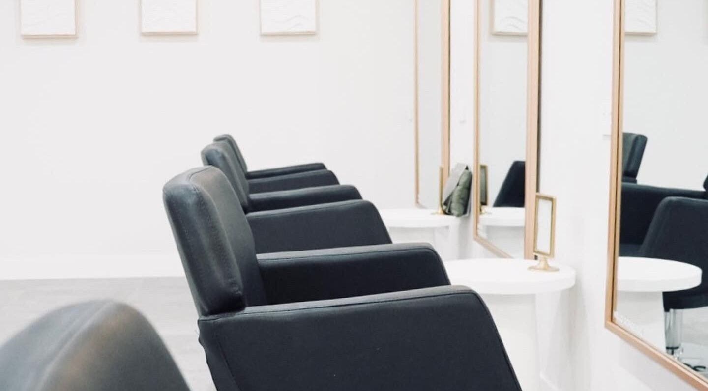 Modern salon chairs at Salon Sloane, Happy Valley, South Australia, AU, offering a sleek and inviting atmosphere.