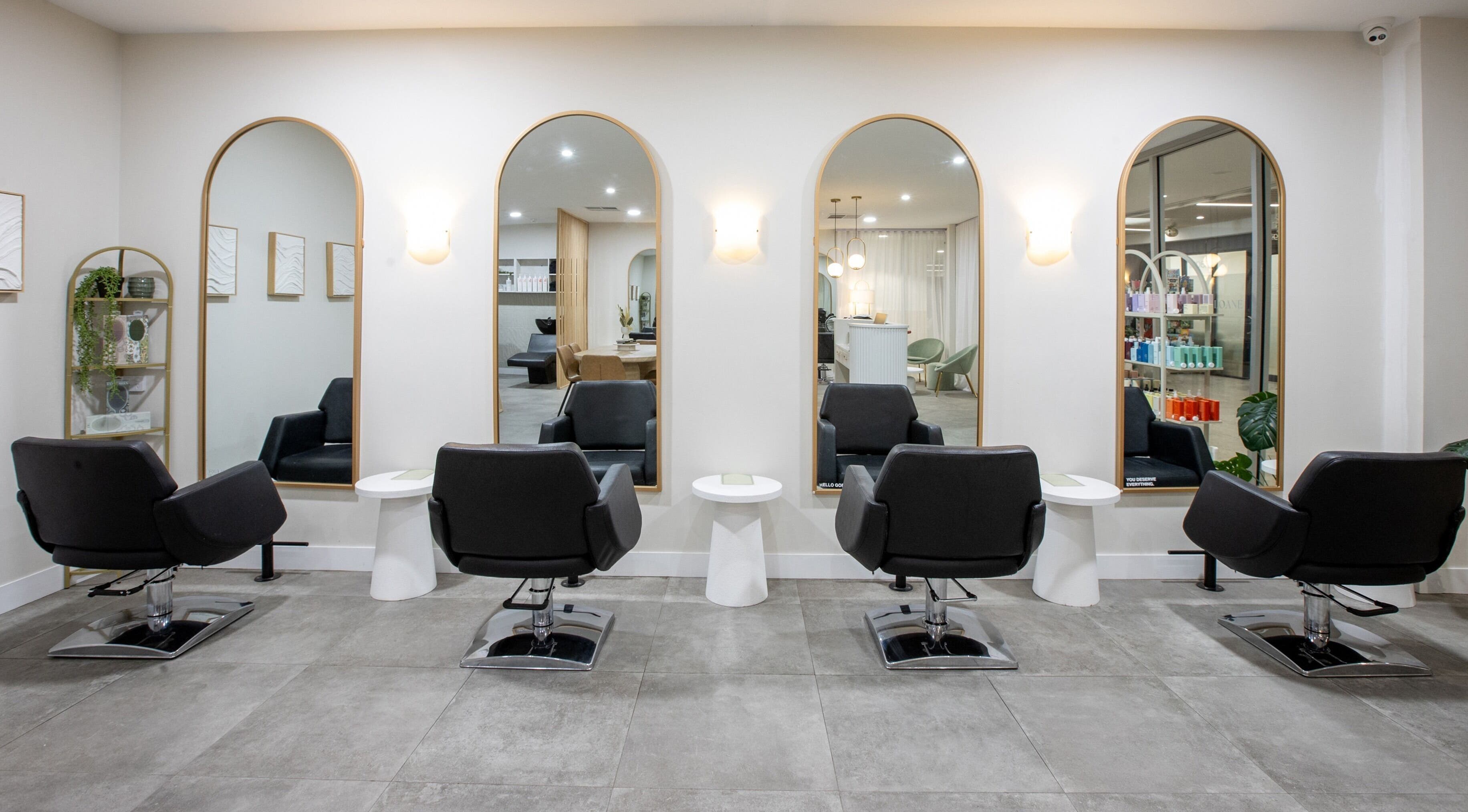 Stylish salon chairs and mirrors at Salon Sloane, Happy Valley, South Australia, AU offering luxury services.