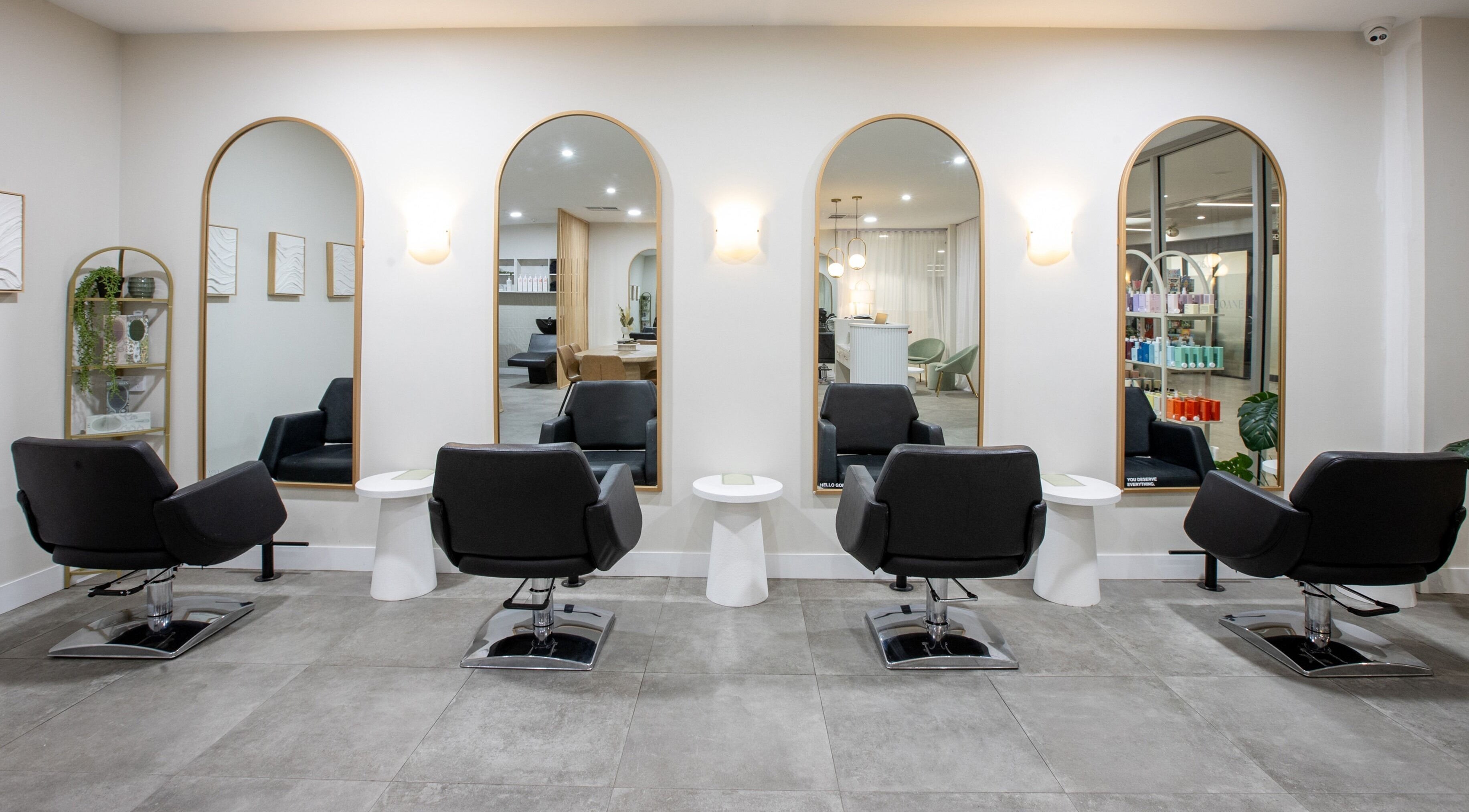 Stylish salon chairs and mirrors at Salon Sloane, Happy Valley, South Australia, AU offering luxury services.