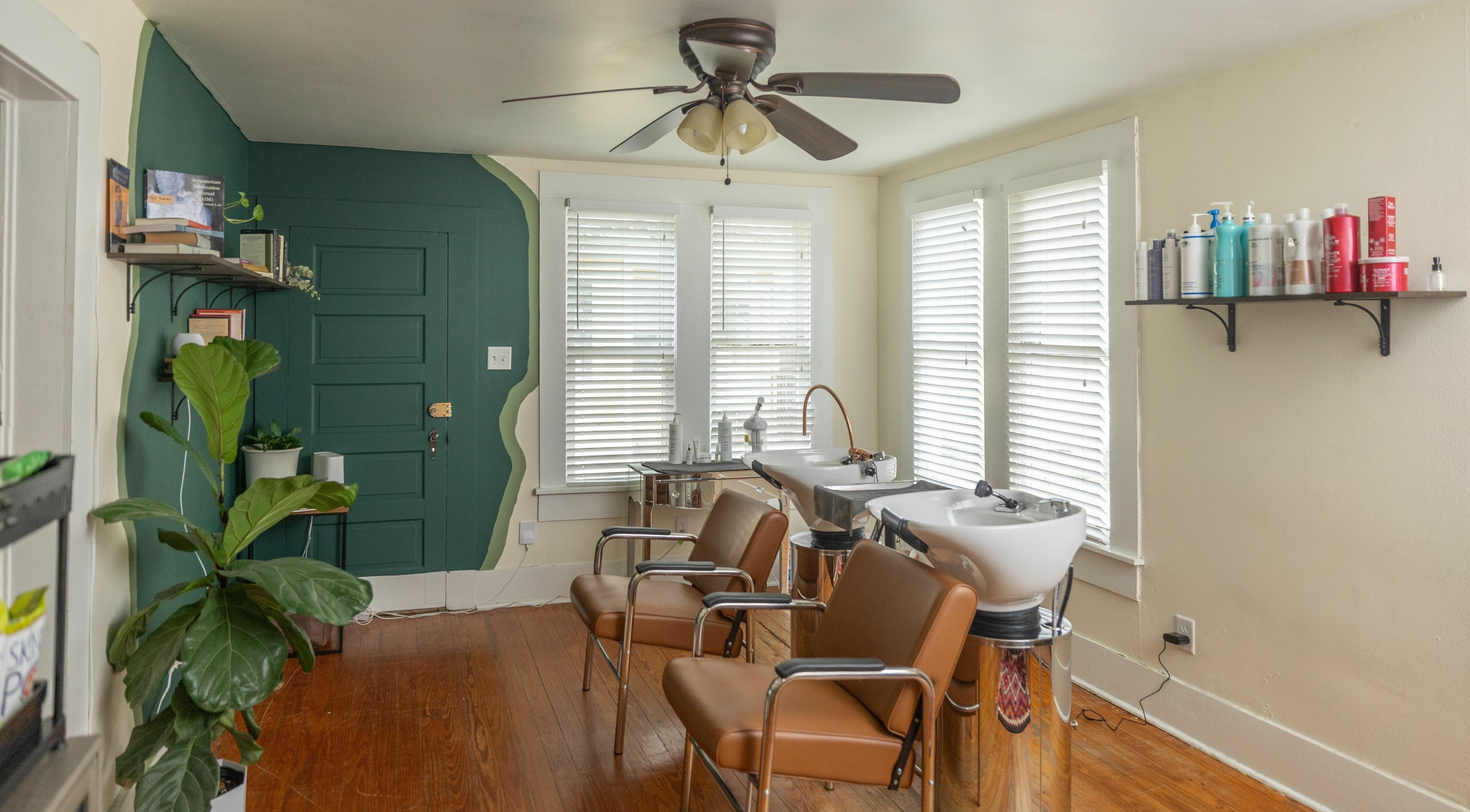 Modern salon chairs and wash station at Awaken Bastrop Energetic Salon in Bastrop, Texas, US.