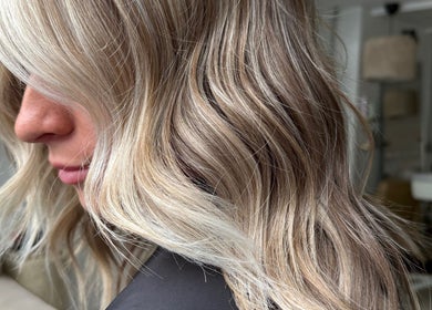 Blonde wavy hairstyle at saradoeshair, Stoke-on-Trent, England, GB, showcasing natural highlights.