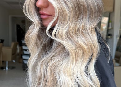 Elegant blonde waves styled at saradoeshair in Stoke-on-Trent, England, GB. Perfect for a glam look.