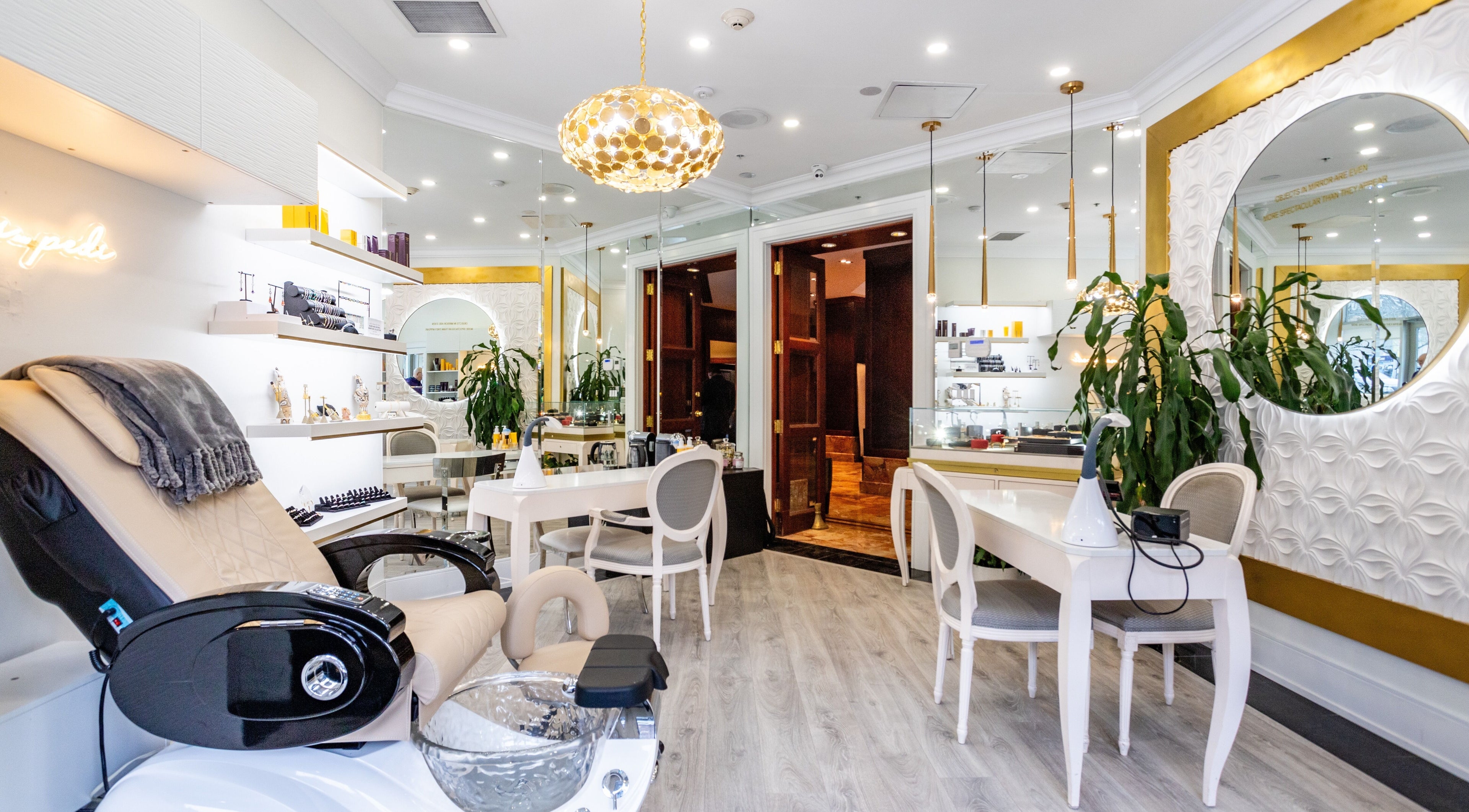 Luxurious interior of Tmpt(d) Beauty & Jewelry Studio in Toronto, Ontario, CA with chic decor and plush seating.