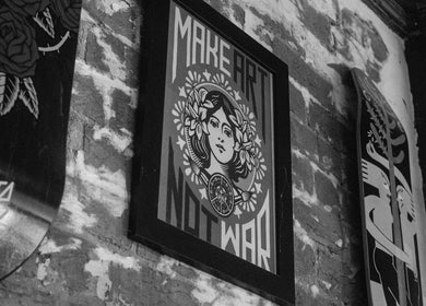 Artistic wall decor at Lighthouse Barbers in Melbourne, Victoria, AU enhancing vintage vibe.