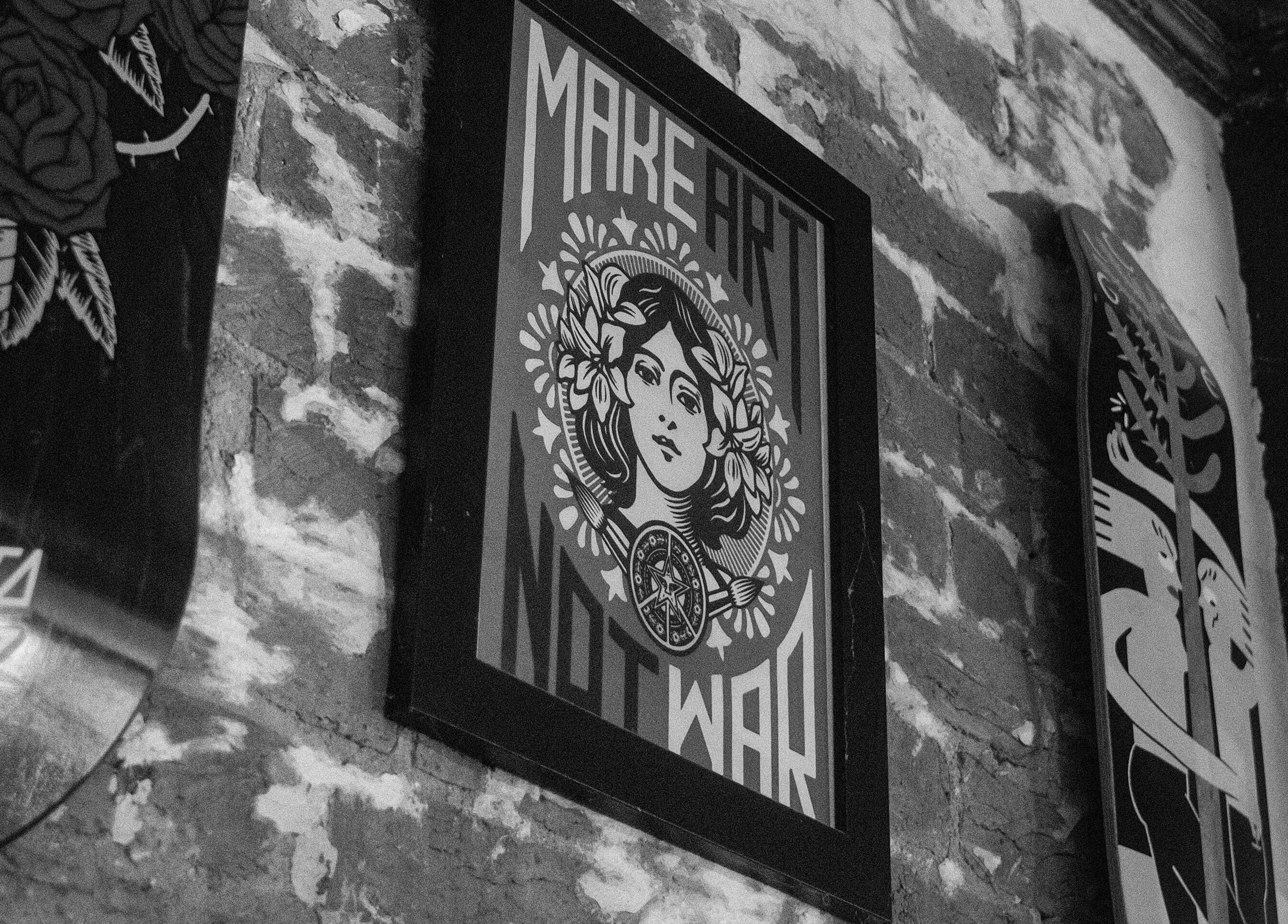 Artistic wall decor at Lighthouse Barbers in Melbourne, Victoria, AU enhancing vintage vibe.