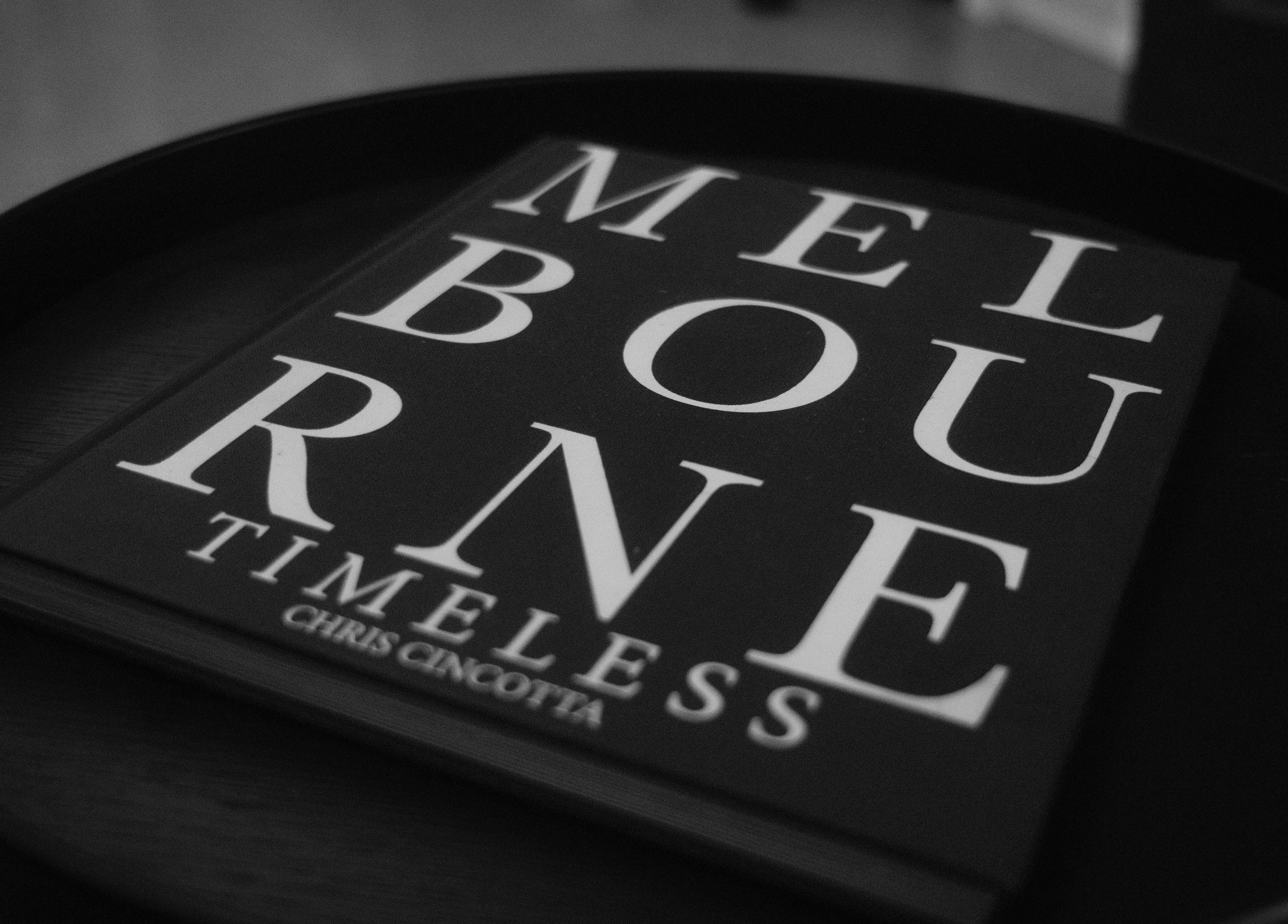 A 'Melbourne Timeless' book on a table at Lighthouse Barbers, Melbourne, Victoria, AU.