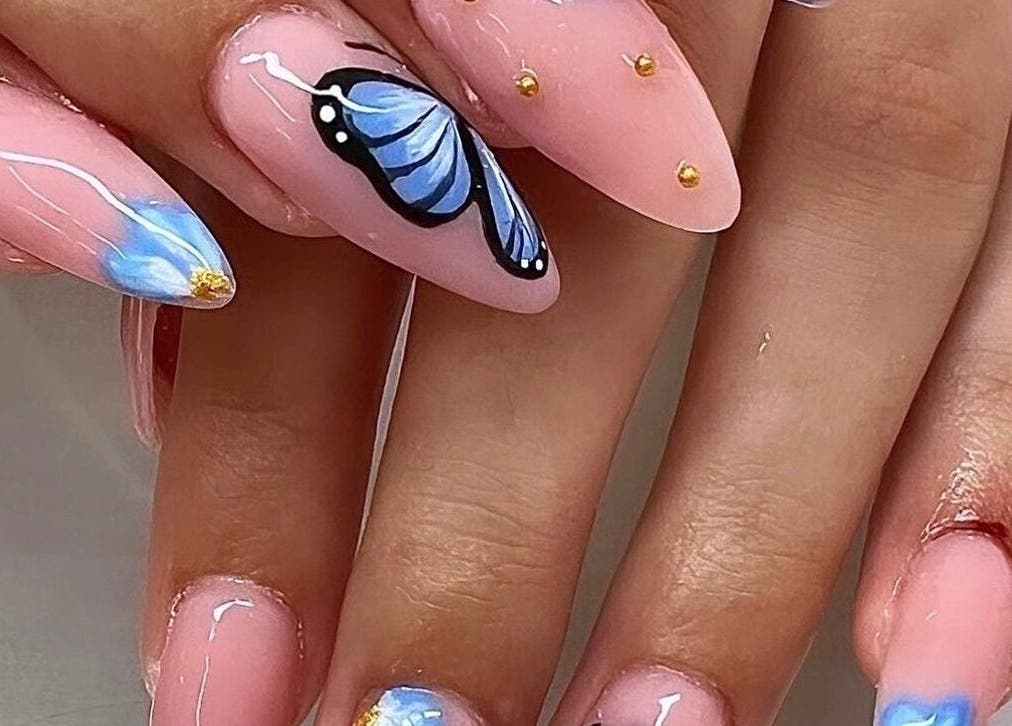 Elegant blue butterfly nail art at Gloxy Nails, Banbridge, Northern Ireland, GB.