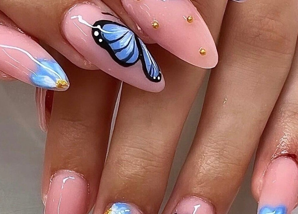 Elegant blue butterfly nail art at Gloxy Nails, Banbridge, Northern Ireland, GB.