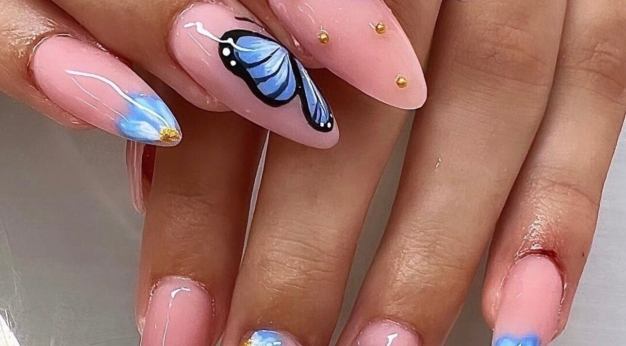 Elegant blue butterfly nail art at Gloxy Nails, Banbridge, Northern Ireland, GB.