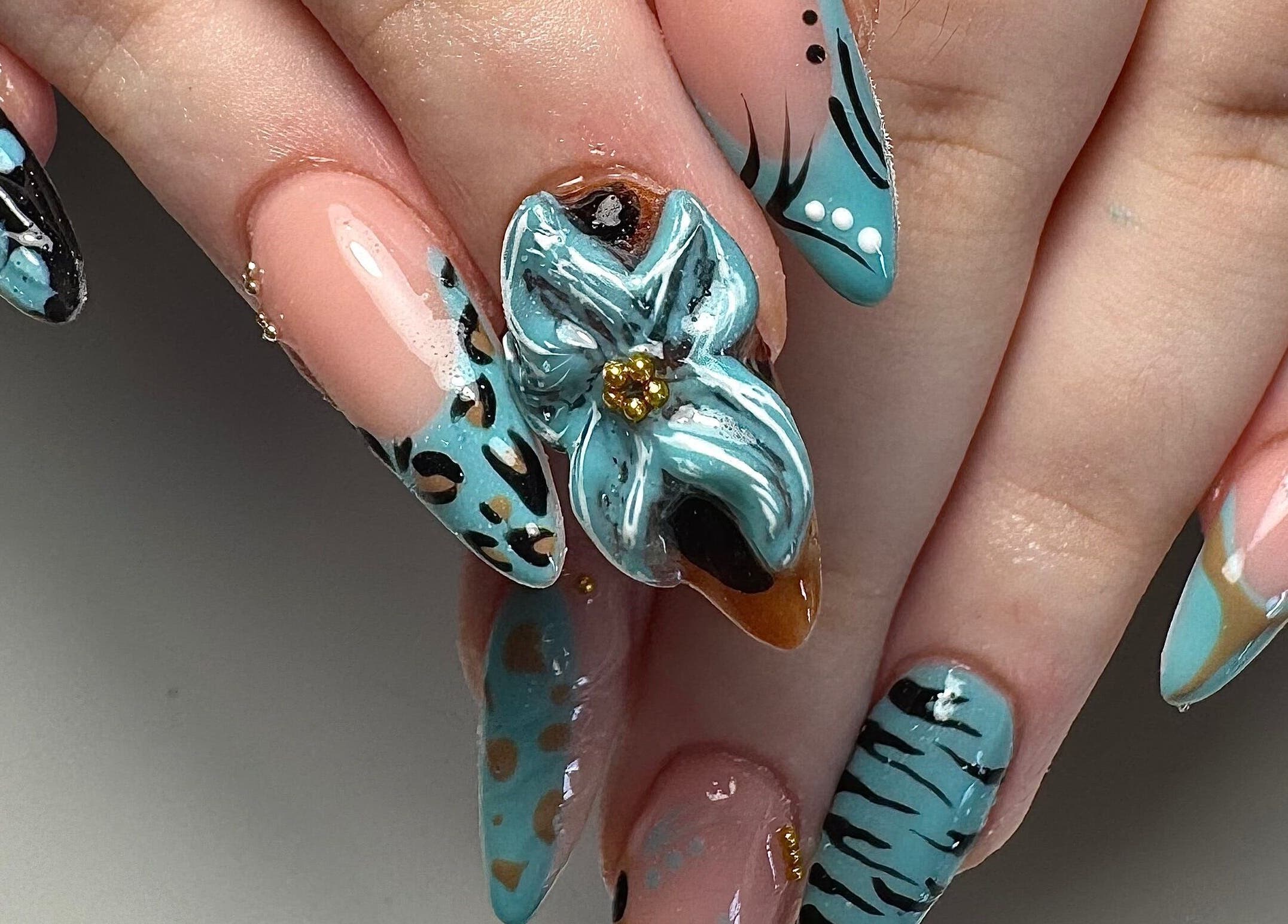 Intricate floral nail art at Gloxy Nails in Banbridge, Northern Ireland, GB.
