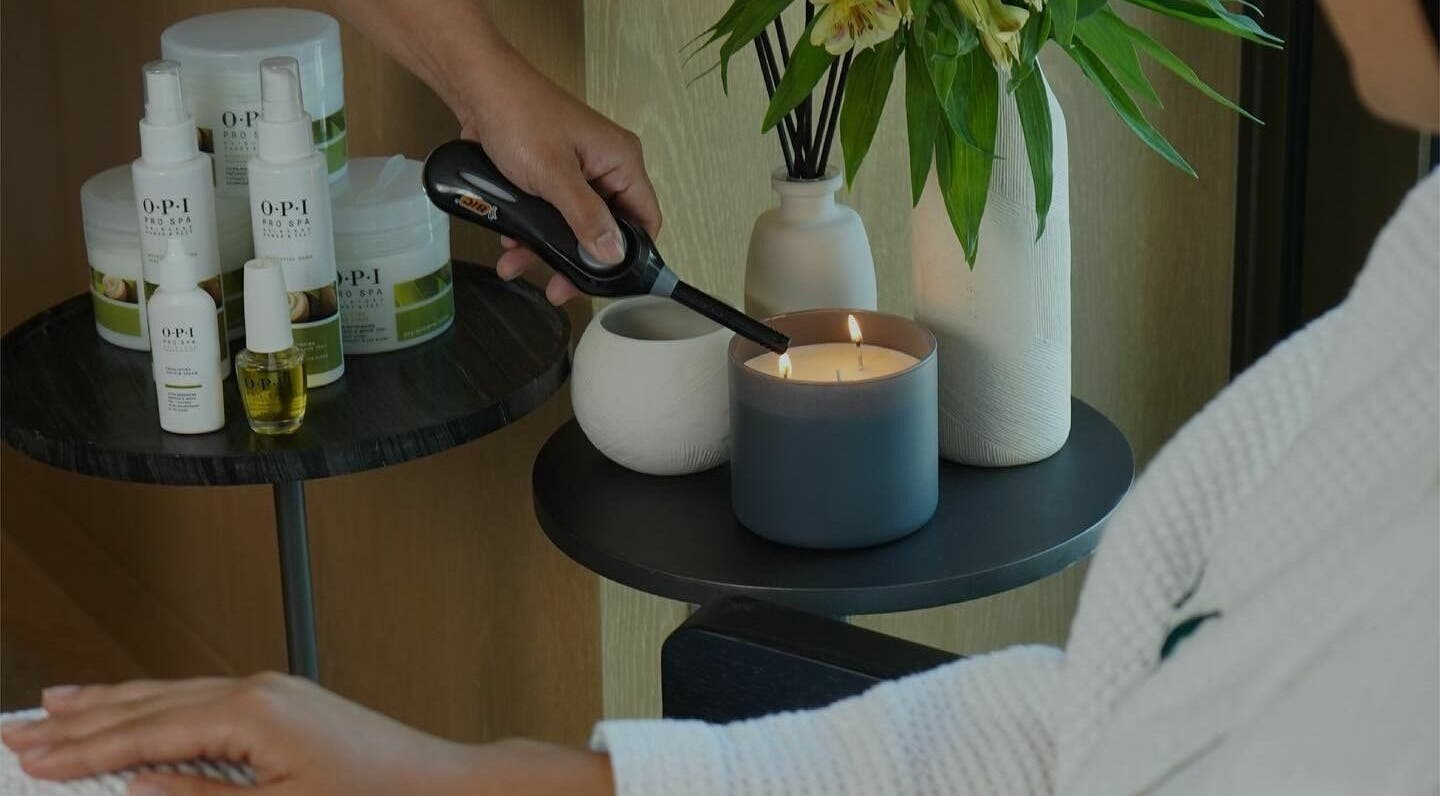 Relaxing candlelit spa setting at Keo Ladies Beauty Salon, Dubai, Dubai, AE, with skincare products.