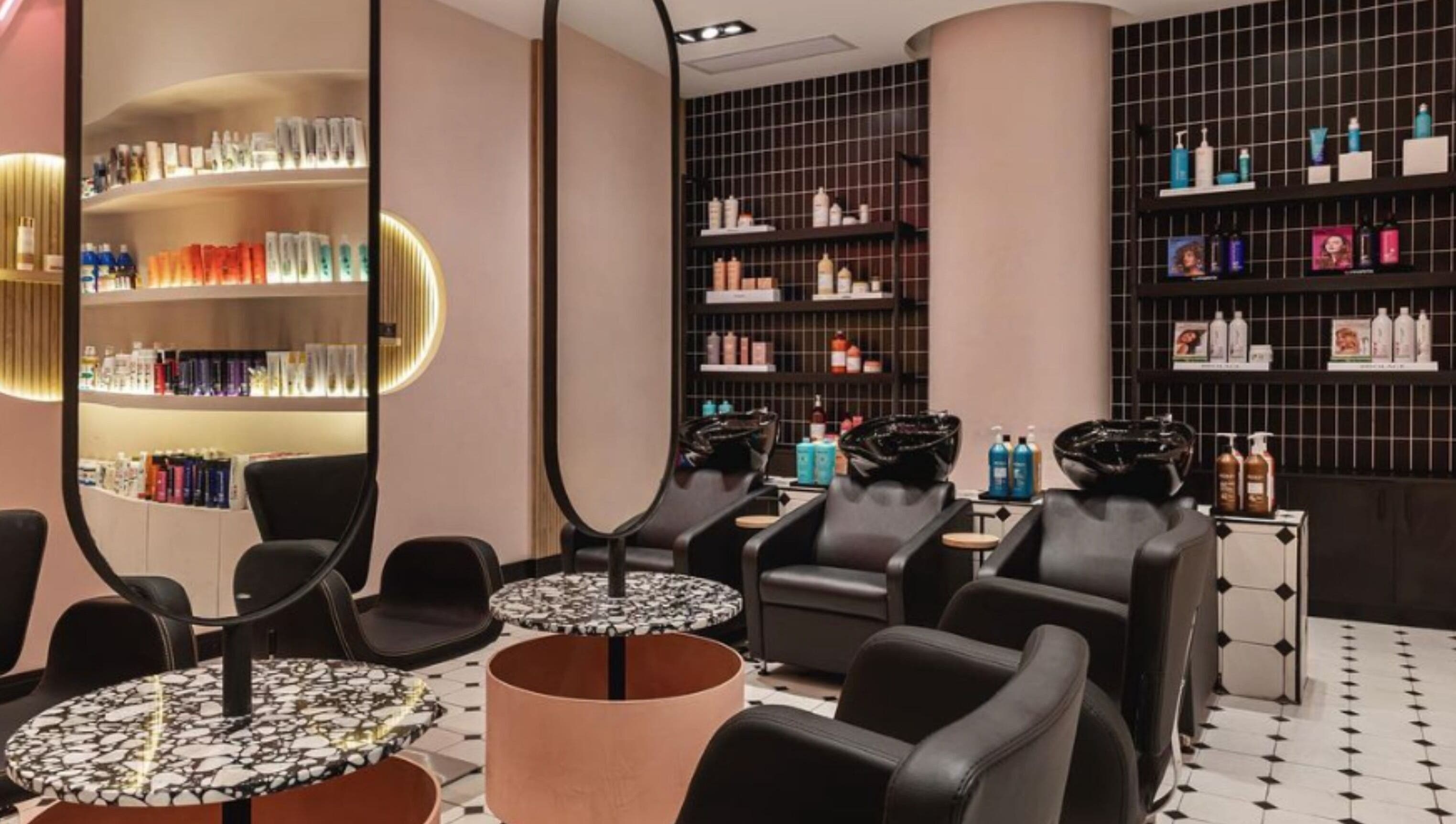 Modern salon interior at The Beauty Lab - Los Cacicazgos, Santo Domingo highlighting sleek styling chairs and products.