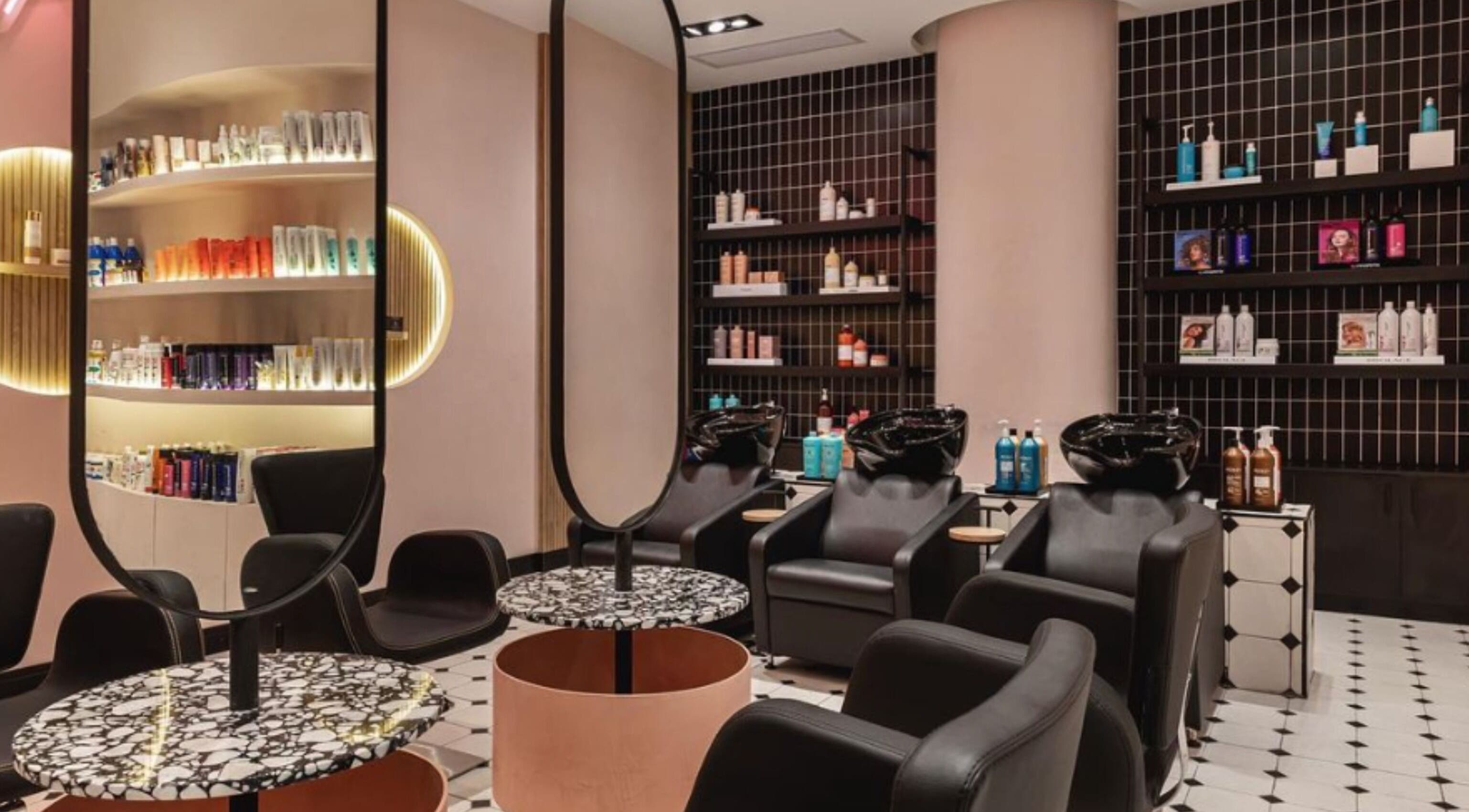 Modern salon interior at The Beauty Lab - Los Cacicazgos, Santo Domingo highlighting sleek styling chairs and products.
