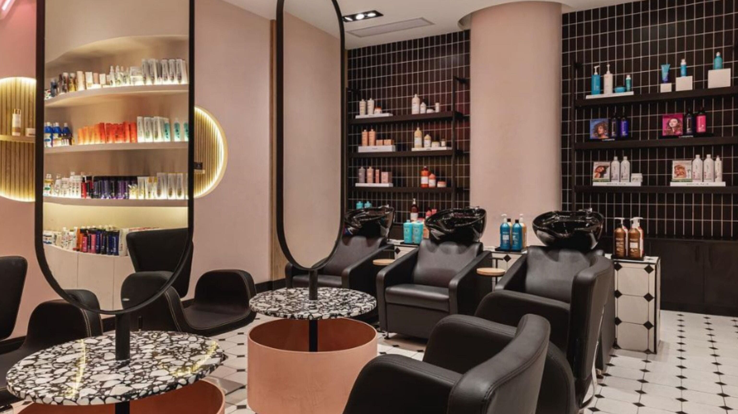 Modern salon interior at The Beauty Lab - Los Cacicazgos, Santo Domingo highlighting sleek styling chairs and products.