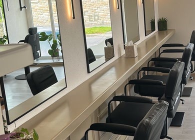 Stylish salon interior with sleek chairs and mirrors at Danielle Harrison hair.makeup.bridal, Rawtenstall, England, GB.