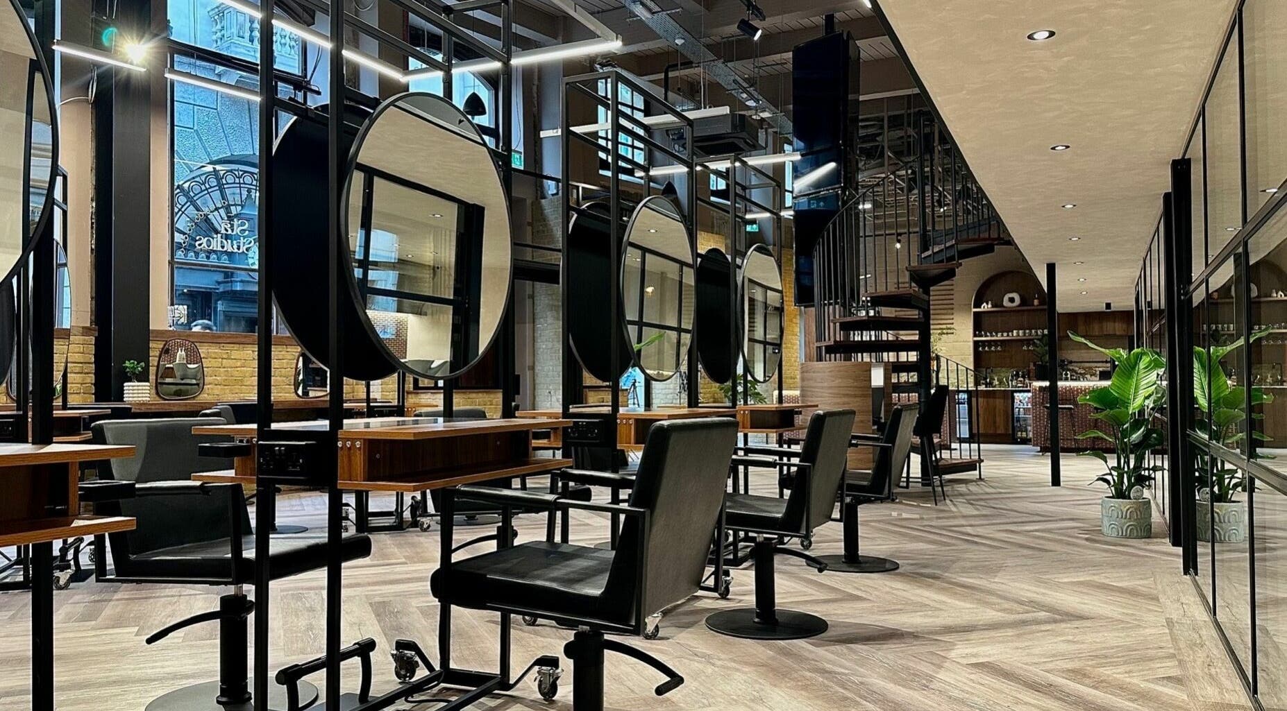 Modern interior of Shannon Southern - Stã Studios in London, England, GB featuring stylish salon chairs and mirrors.