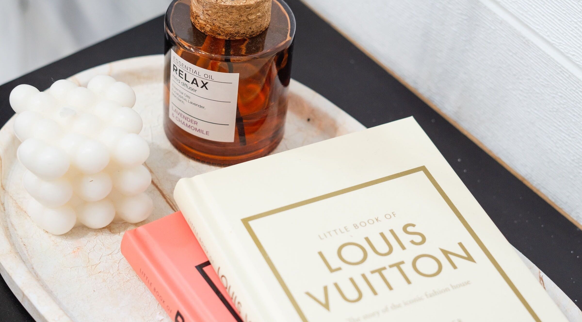 Relaxing diffuser and decorative books at Besighini Beauty in Maroubra, New South Wales, AU.