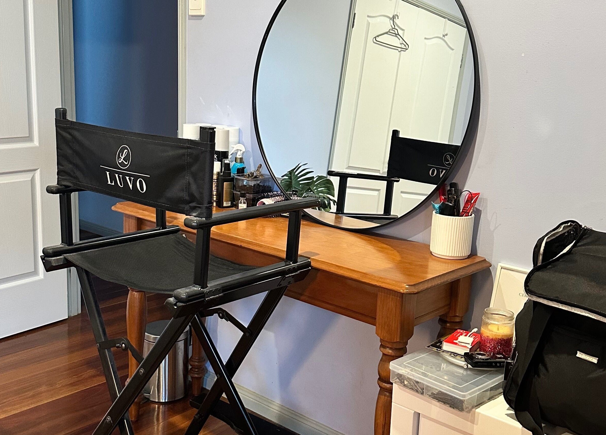 Studio Marianna's chic makeup station at Holland Park West, Queensland, AU, with chair and mirror setup.