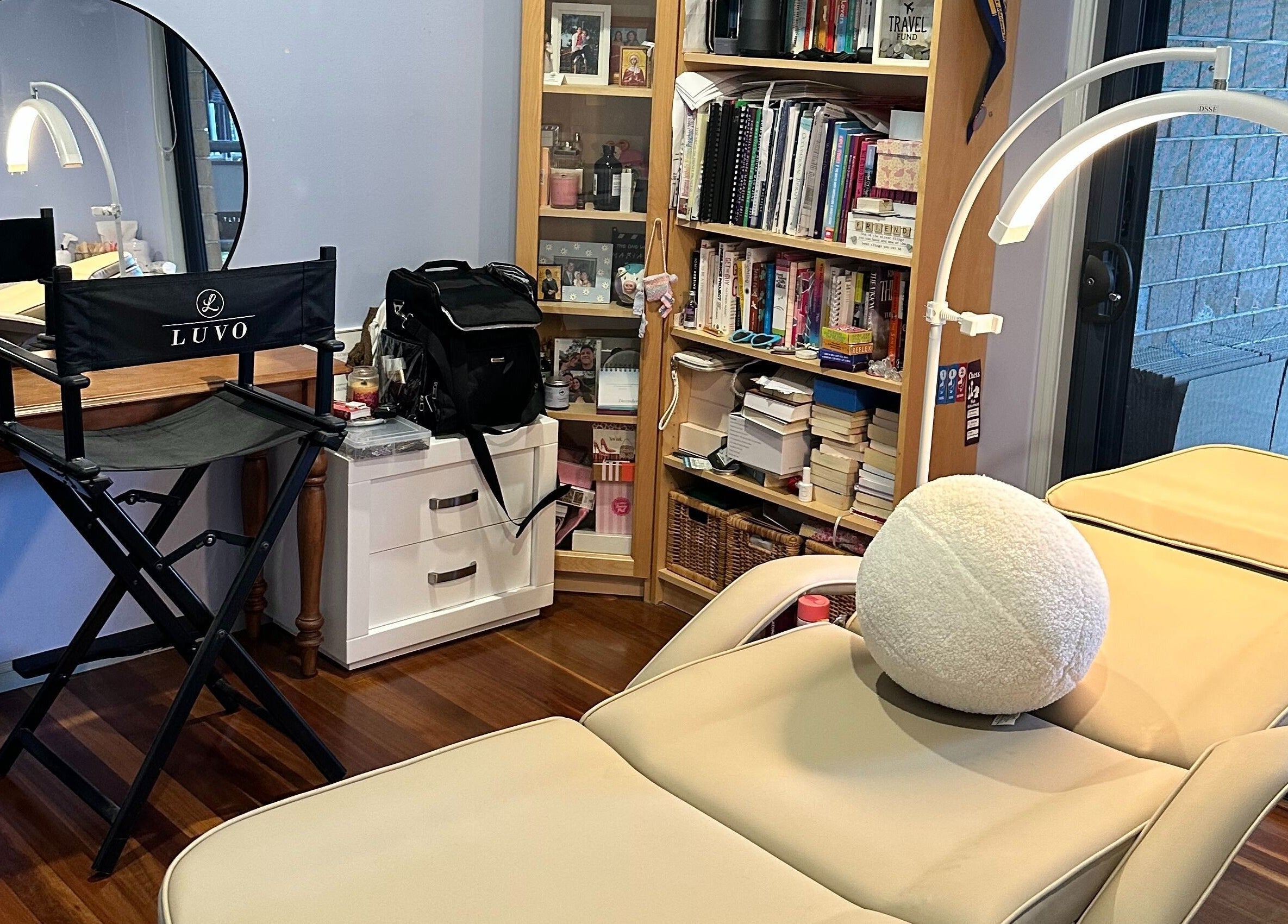 Studio Marianna's inviting beauty setup in Holland Park West, Queensland, AU with chair, mirror, and relaxing bed.