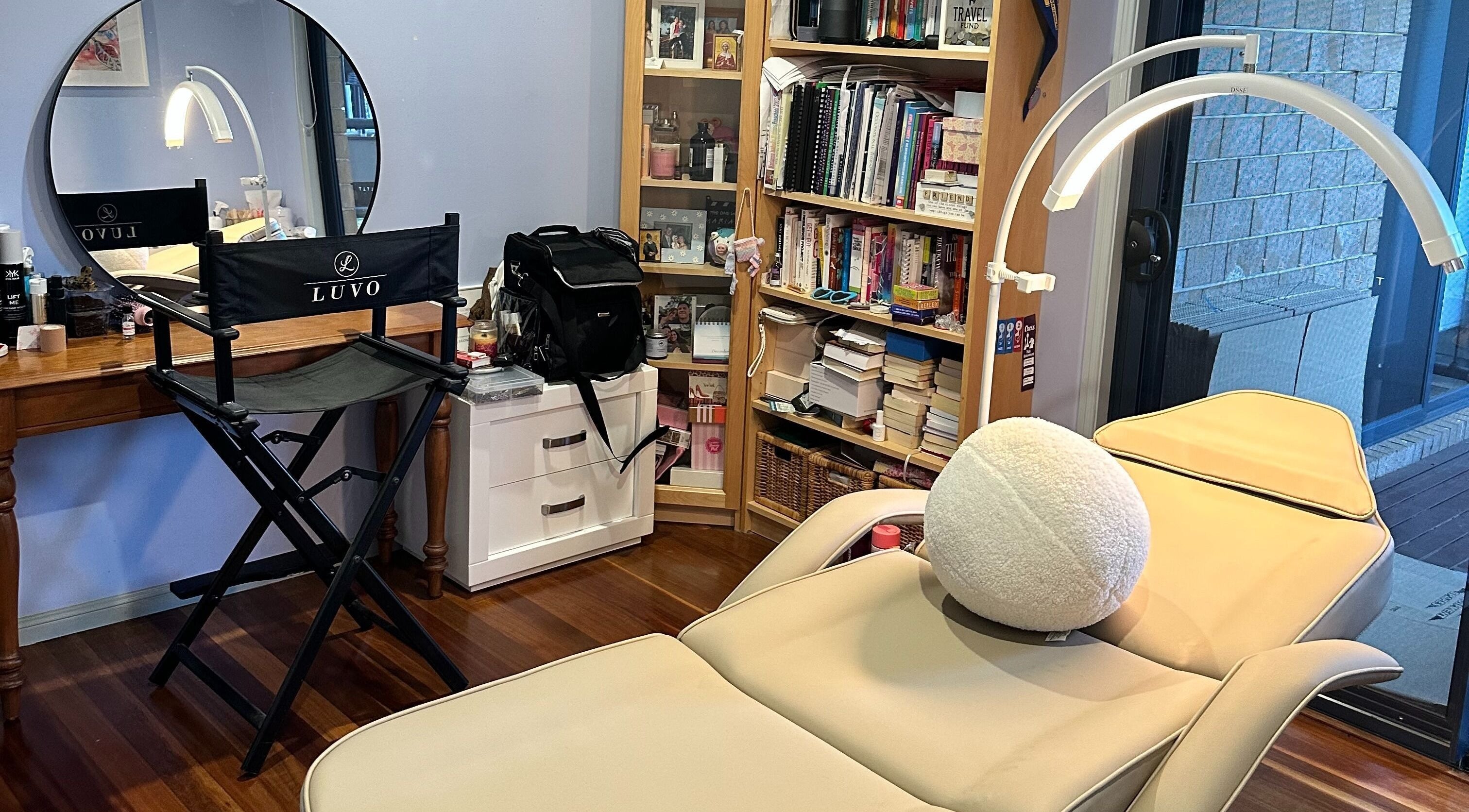 Studio Marianna's inviting beauty setup in Holland Park West, Queensland, AU with chair, mirror, and relaxing bed.