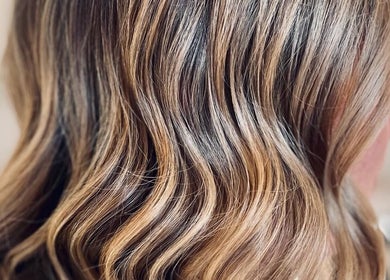 Elegant wavy hair styled at The Vanity in Turvey Park, New South Wales, AU, showcasing beautifying expertise.