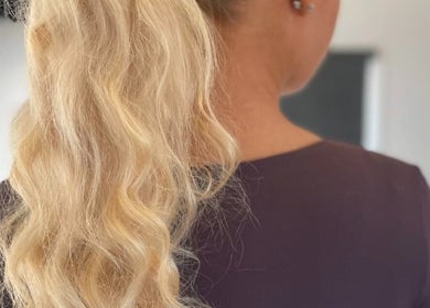 Elegant wavy blonde hairstyle at The Vanity, Turvey Park, New South Wales, AU.