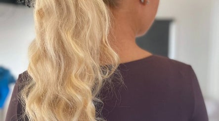 Elegant wavy blonde hairstyle at The Vanity, Turvey Park, New South Wales, AU.