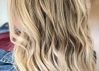 Blonde wavy hair styled at The Vanity in Turvey Park, New South Wales, AU, showcasing professional salon quality.