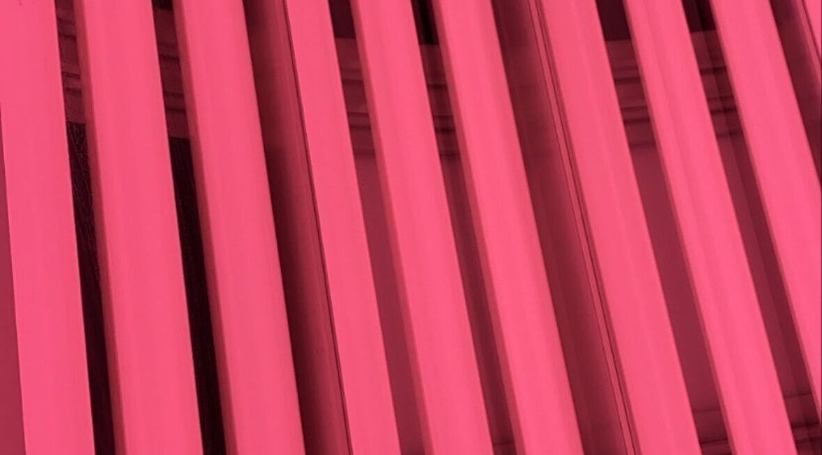 Radiant pink vertical lights at CS Tan in Melbourne, Victoria, AU create a warm, inviting ambiance.
