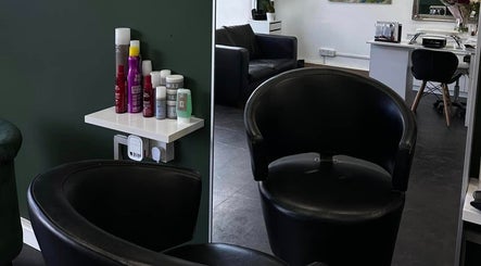 Elegant salon interior at SORSIA, Bournemouth, England, GB featuring modern chairs and beauty products.