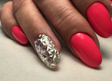 Close-up of vibrant pink and diamond nail art at SORSIA, Bournemouth, England, GB.