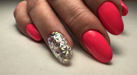 Close-up of vibrant pink and diamond nail art at SORSIA, Bournemouth, England, GB.