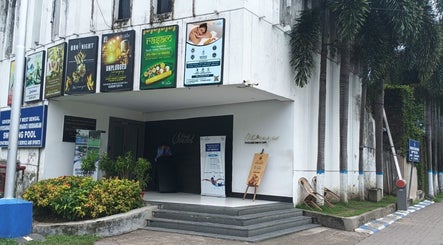 Entrance of Meghavi Wellness Spa | The Stadel in Kolkata, West Bengal, IN adorned with vibrant banners.