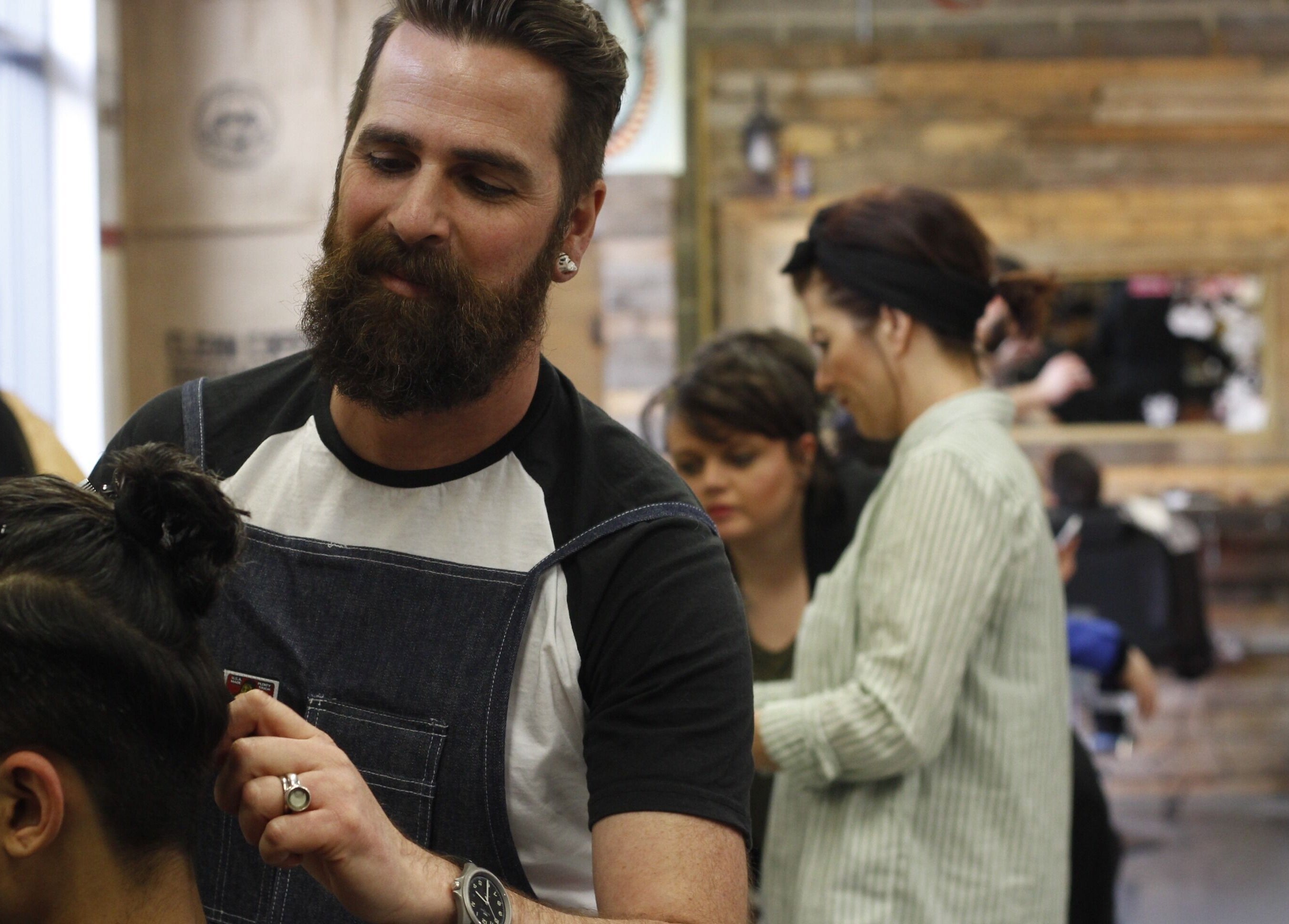 Professional barber styling hair at SB Barbering Academy Sunderland, located in Sunderland, England, GB.