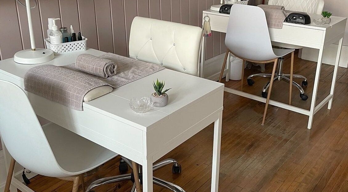 Modern manicure stations at Sundara Spa, Midland, Ontario, CA, featuring plush chairs and elegant decor.