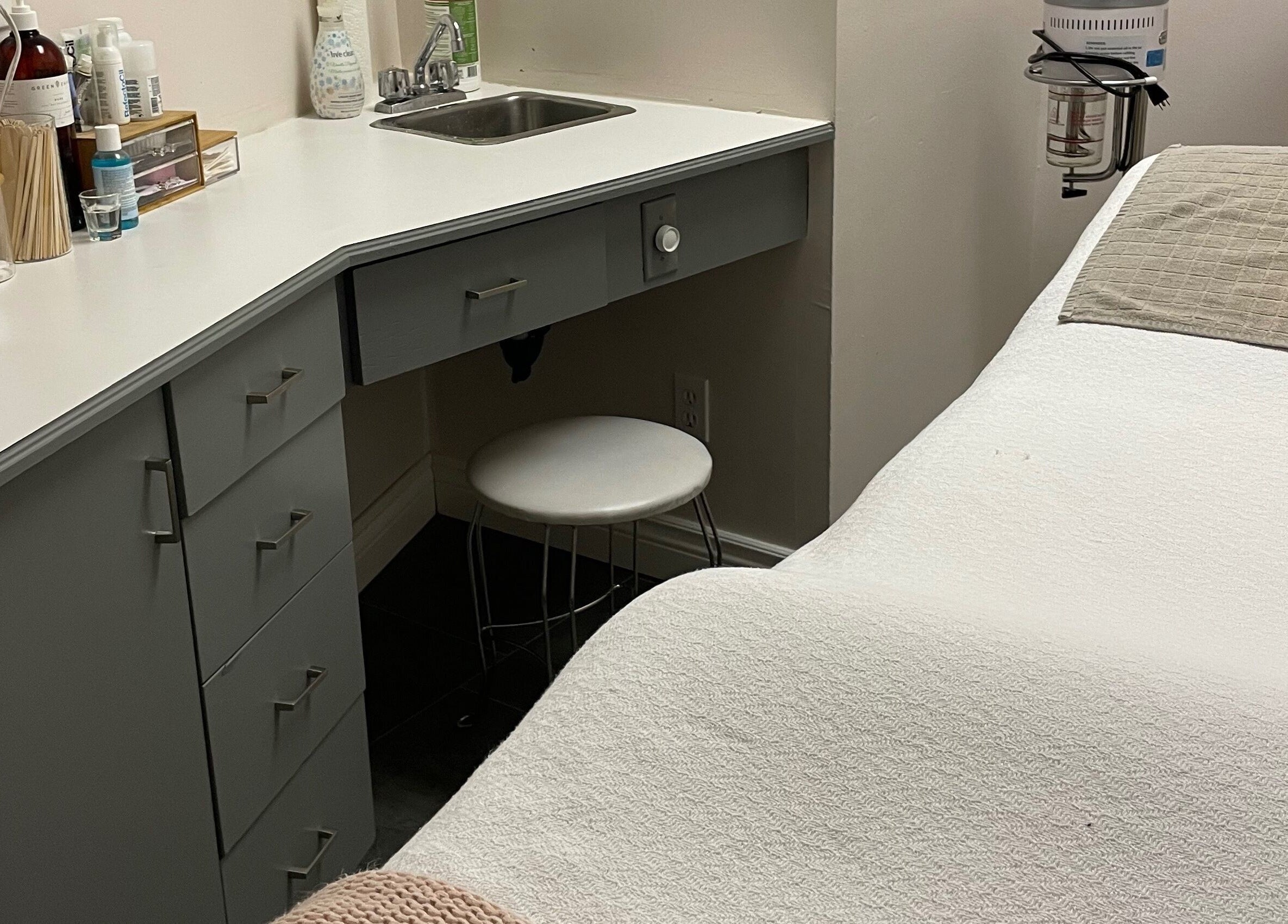 Serene treatment room at Sundara Spa, Midland, Ontario, CA with massage table and modern amenities.