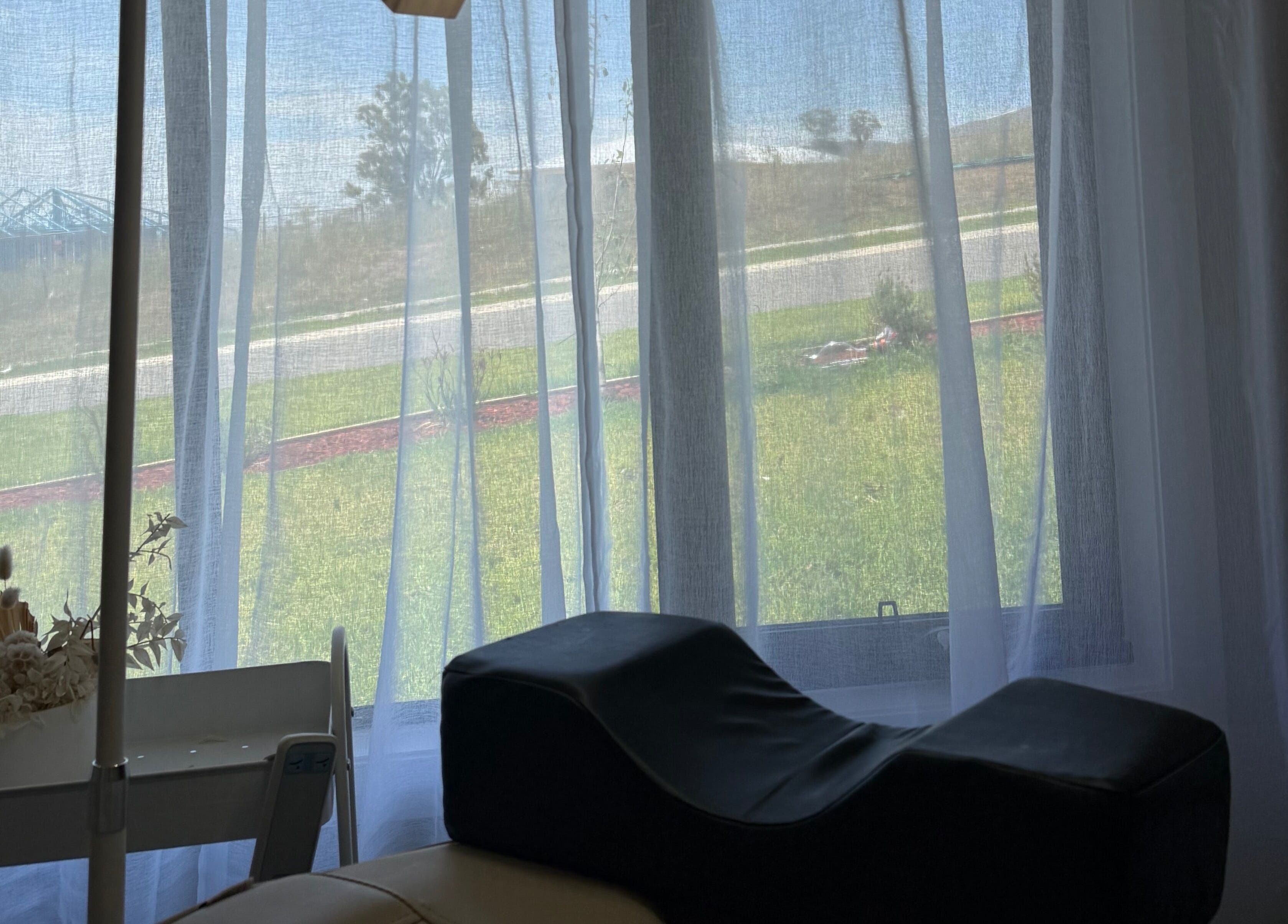 Peaceful treatment room at Amanda’s Beauty Room, Muswellbrook, New South Wales, AU with serene window view.