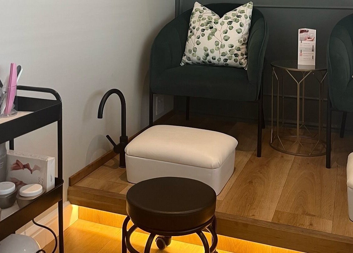 Cozy seating area at The Skin Firm, Cape Town, Western Cape, ZA, showcasing a stylish beauty and wellness setup.