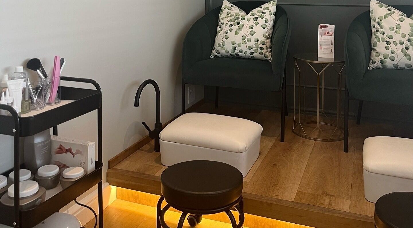 Cozy seating area at The Skin Firm, Cape Town, Western Cape, ZA, showcasing a stylish beauty and wellness setup.