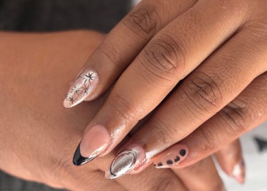 Detailed nail art with floral and metallic designs at The Beauty Box, Cape Town, Western Cape, ZA.